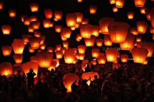 People release sky lanterns to celebrate the traditional Chinese Sky Lantern Festival in Pingsi, Taipei County